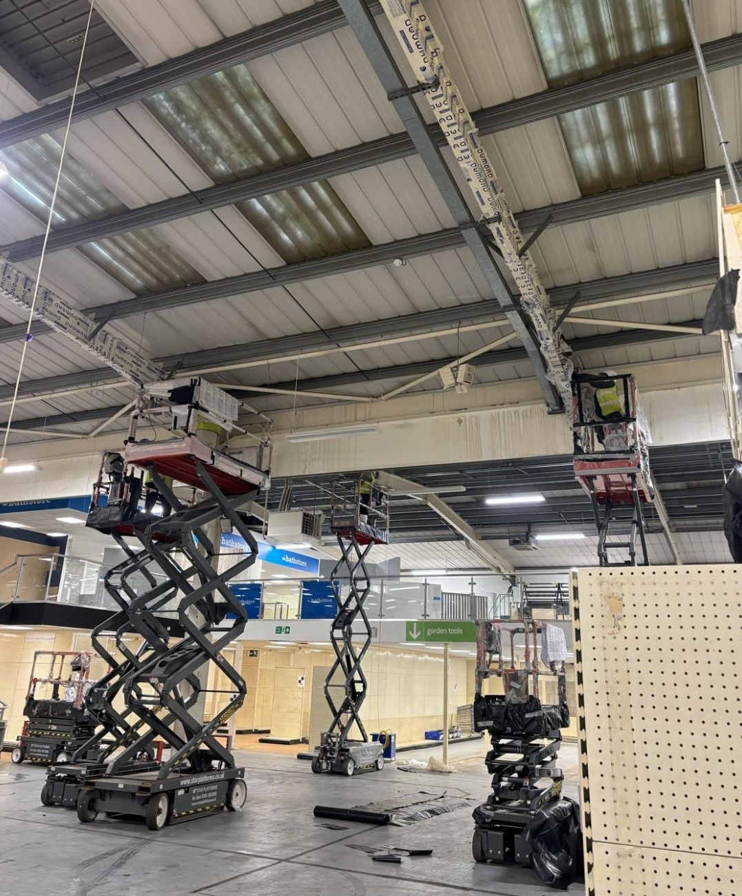 Fire Fort intumescent paint contractors coating a steel frame structure in Surrey for passive fire protection compliance